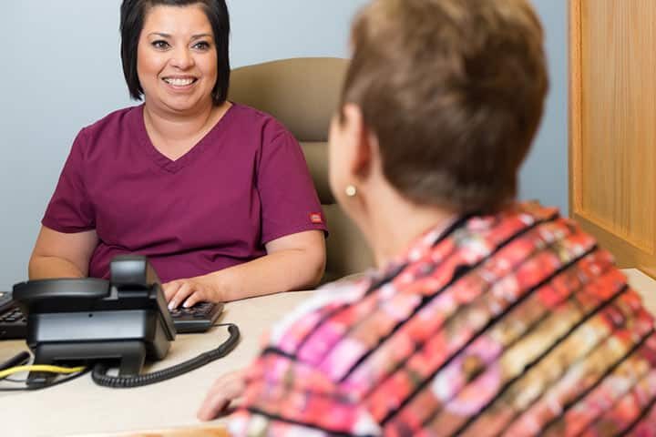 Dental Staff with a Dental Patient | About Us | West Liberty, IA, North Liberty, IA and Muscatine, IA | Gentle Family Dentists