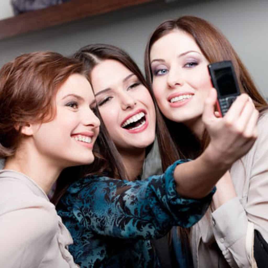 Three Pretty Girls Taking a Photo | Cosmetic Dentistry in West Liberty, IA, North Liberty, IA and Muscatine, IA | Gentle Family Dentists