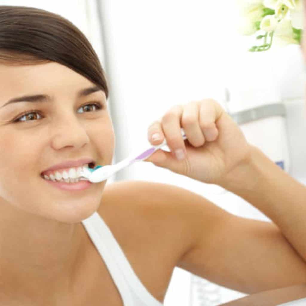 Young Girl Carefully Brushing Her Teeth | Dental Prevention in West Liberty, IA, North Liberty, IA and Muscatine, IA | Gentle Family Dentists