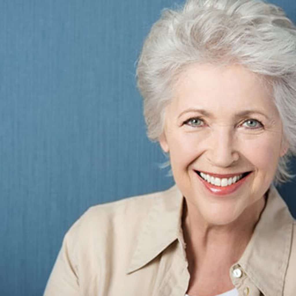 Confident Old Woman Brightly Smiling | Dental Crowns and Bridges in West Liberty, IA, North Liberty, IA and Muscatine, IA | Gentle Family Dentists