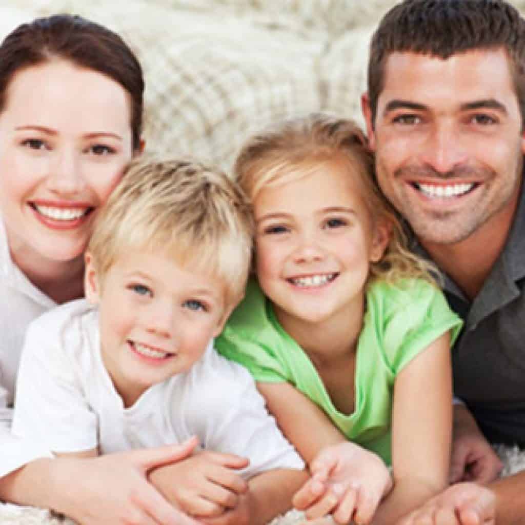 Gleeful Family of Four | Full-Mouth Reconstruction in West Liberty, IA, North Liberty, IA and Muscatine, IA | Gentle Family Dentists