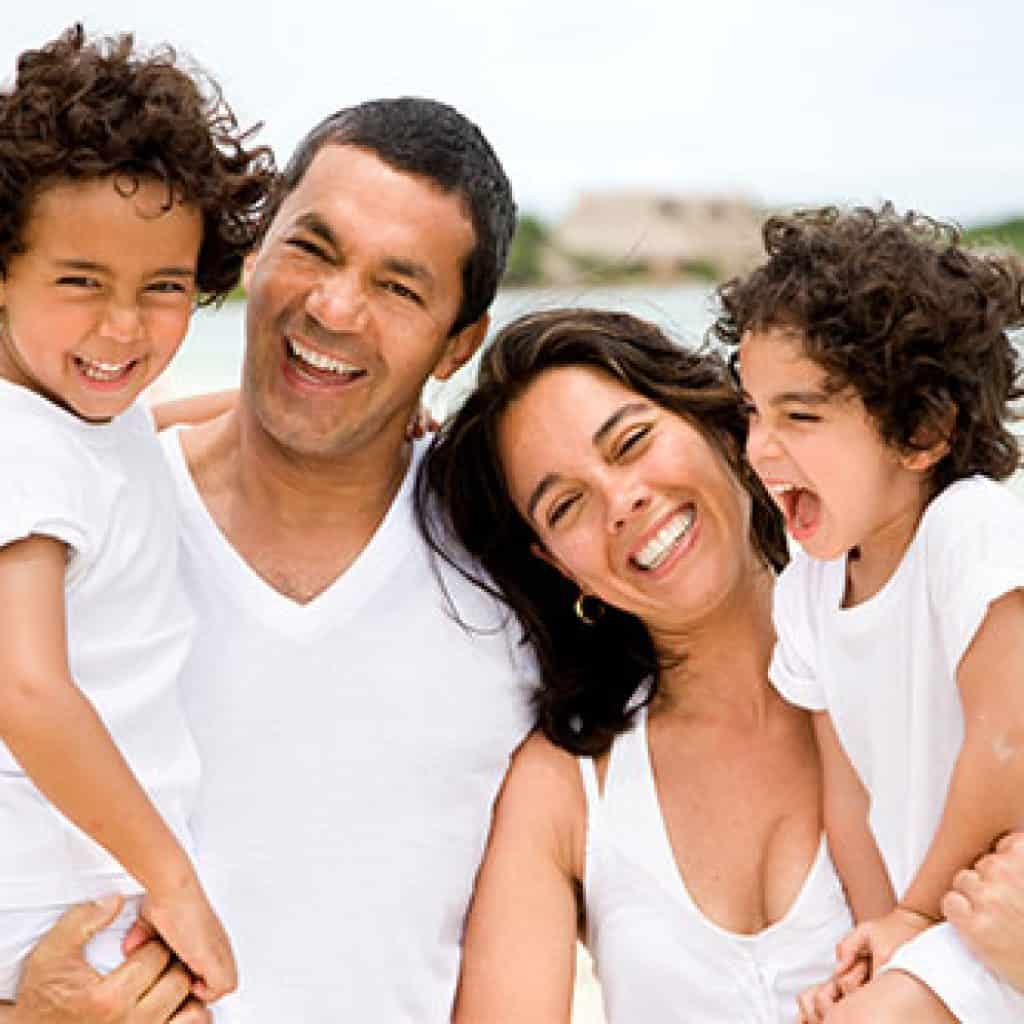 Joyous Family of Four | Family Dentistry in West Liberty, IA, North Liberty, IA and Muscatine, IA | Gentle Family Dentists