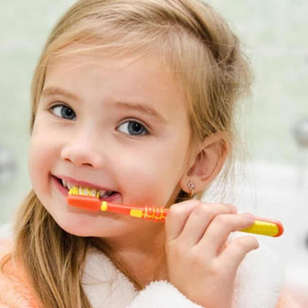 Cute Girl Brushing Her Teeth | Pediatric Dentistry in West Liberty, IA, North Liberty, IA and Muscatine, IA | Gentle Family Dentists