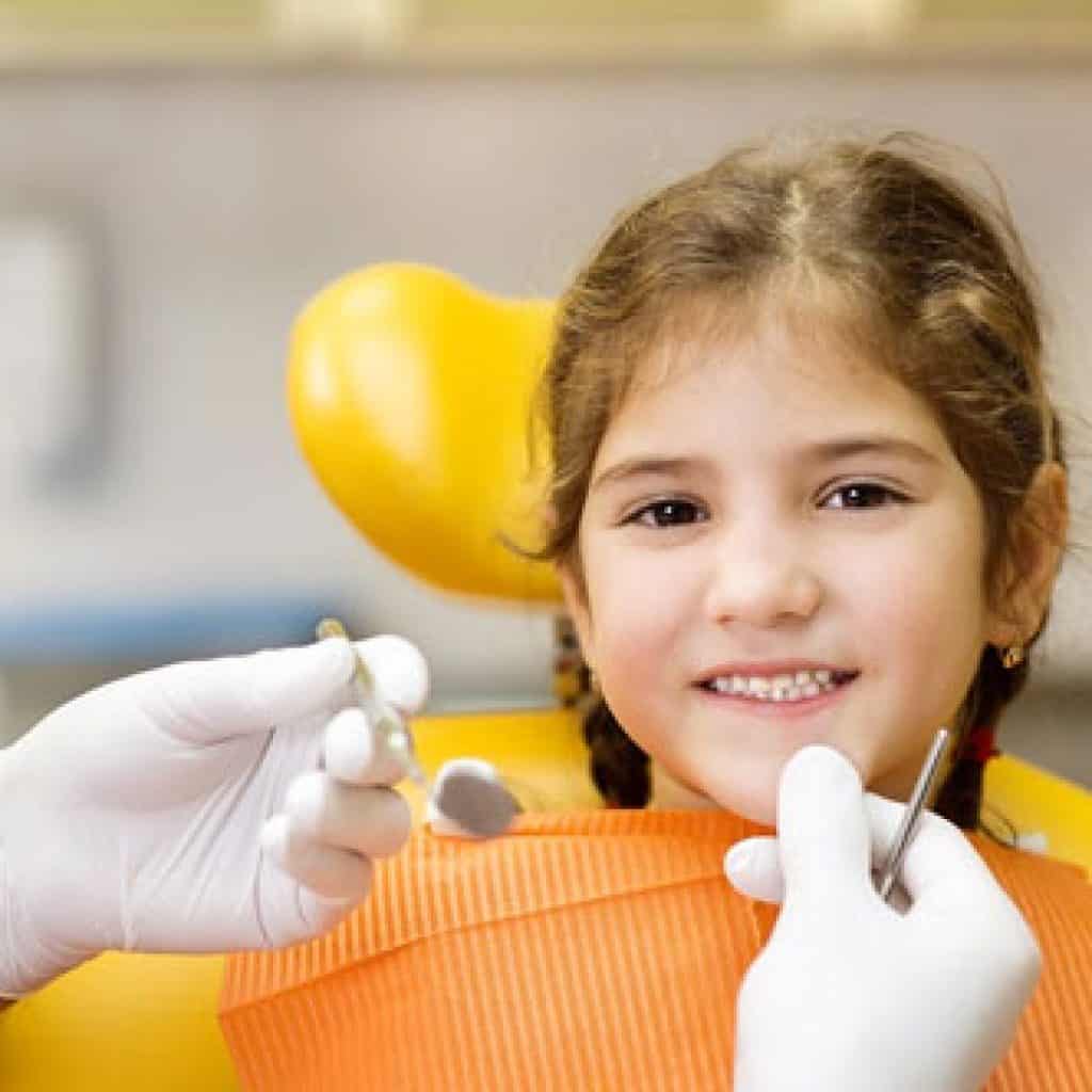 Smiling Little Girl During Her Dental Examination | Preventative Orthodontics Kids in West Liberty, IA, North Liberty, IA and Muscatine, IA | Gentle Family Dentists