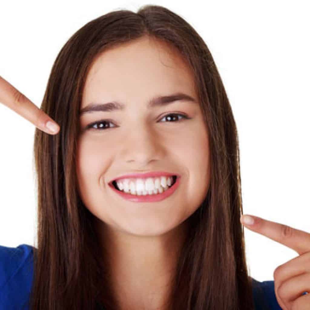 Young Lady Showing Her Beautiful Teeth | Root Canal Treatment in West Liberty, IA, North Liberty, IA and Muscatine, IA | Gentle Family Dentists