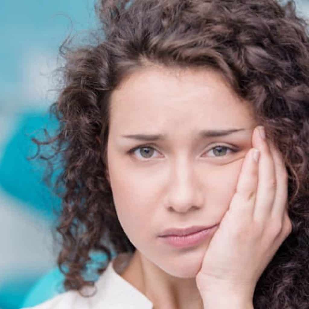 Young Lady Suffering from Toothache | West Liberty, IA, North Liberty, IA and Muscatine, IA | Gentle Family Dentists