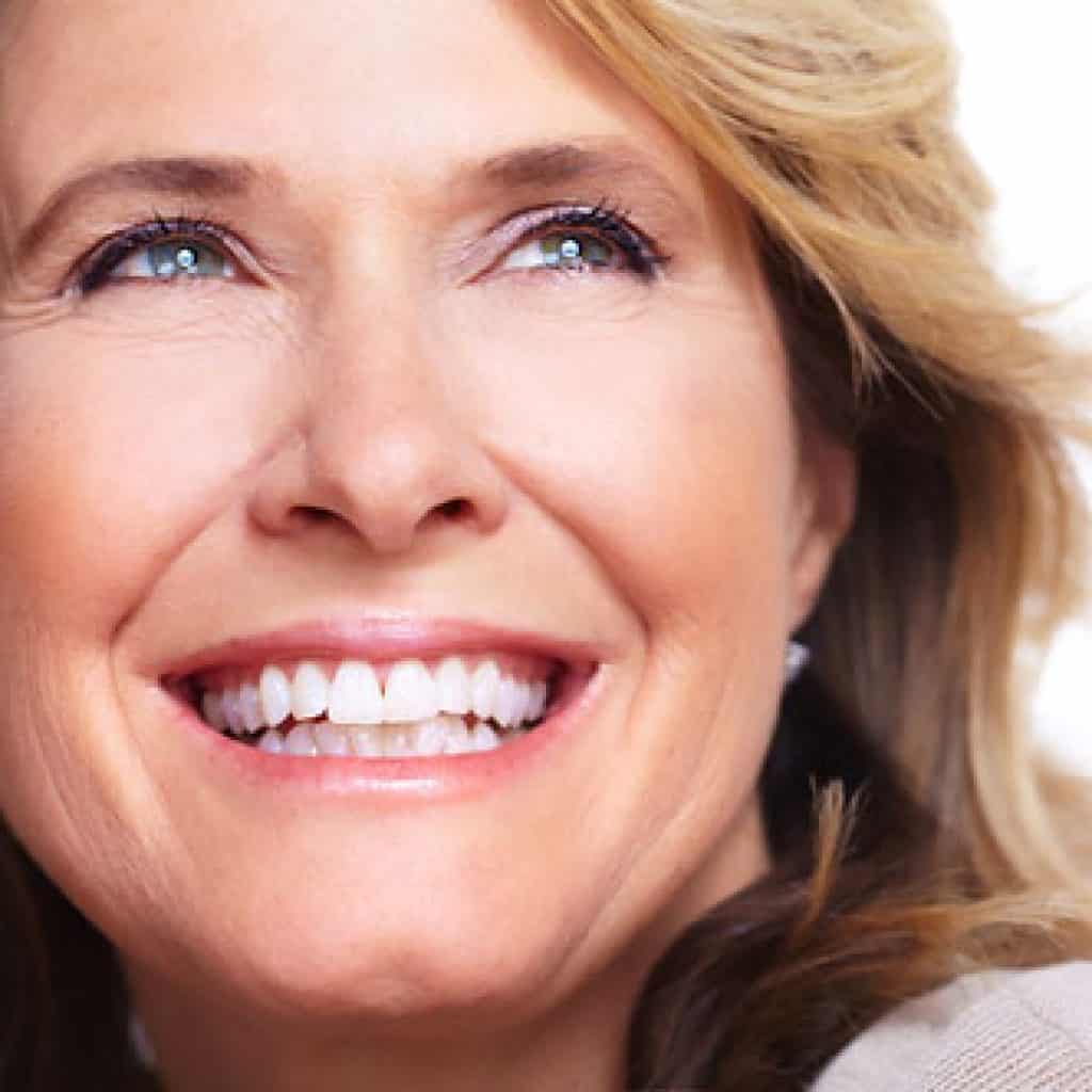 Old Woman showing a fulfilling smile | West Liberty, IA, North Liberty, IA and Muscatine, IA | Gentle Family Dentists