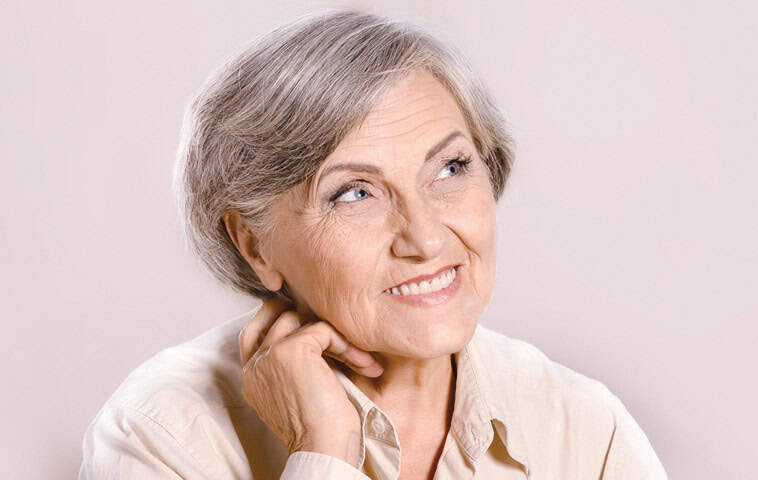 Old Lady with Dentures looking up and smiling | Muscatine, IA | Gentle Family Dentists