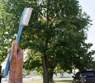 Welcome Statue in front of the Dental Office in Muscatine, IA | Gentle Family Dentists