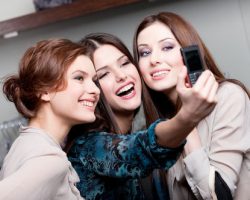 Three Pretty Girls Taking a Photo | Cosmetic Dentistry in West Liberty, IA, North Liberty, IA and Muscatine, IA | Gentle Family Dentists