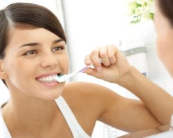 Young Girl Carefully Brushing Her Teeth | Dental Prevention in West Liberty, IA, North Liberty, IA and Muscatine, IA | Gentle Family Dentists