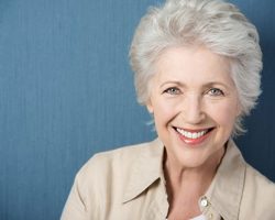 Confident Old Woman Brightly Smiling | Dental Crowns and Bridges in West Liberty, IA, North Liberty, IA and Muscatine, IA | Gentle Family Dentists