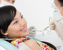 Smiling Young Girl with her Dentist | Dental Emergency in West Liberty, IA, North Liberty, IA and Muscatine, IA | Gentle Family Dentists