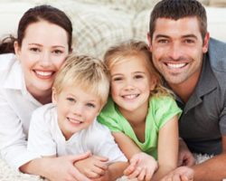 Gleeful Family of Four | Full-Mouth Reconstruction in West Liberty, IA, North Liberty, IA and Muscatine, IA | Gentle Family Dentists