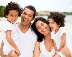 Joyous Family of Four | Family Dentistry in West Liberty, IA, North Liberty, IA and Muscatine, IA | Gentle Family Dentists