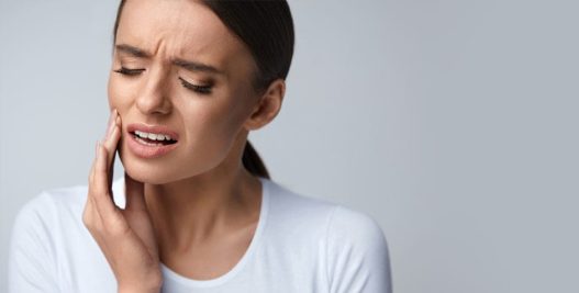 Lady pained with her toothache | Restorative Dental Treatments: Chewing Difficulty Solution in West Liberty, IA, North Liberty, IA and Muscatine, IA | Gentle Family Dentists