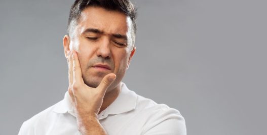 Elderly Guy Suffering from Dental pain | Dental Pain Relief & Treatment in West Liberty, IA, North Liberty, IA and Muscatine, IA | Gentle Family Dentists