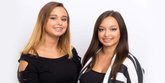 Healthy-looking women with traditonal braces | Orthodontics Treatment Options in Muscatine, IA | Gentle Family Dentists