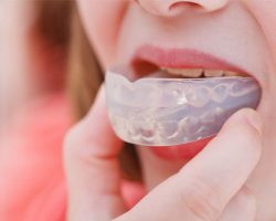 Woman Wearing a Clear-Colored Mouthguard | West Liberty, IA, North Liberty, IA and Muscatine, IA | Gentle Family Dentists