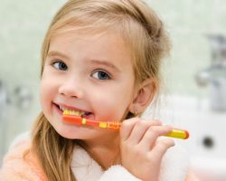 Cute Girl Brushing Her Teeth | Pediatric Dentistry in West Liberty, IA, North Liberty, IA and Muscatine, IA | Gentle Family Dentists