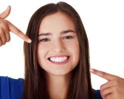 Young Lady Showing Her Beautiful Teeth | Root Canal Treatment in West Liberty, IA, North Liberty, IA and Muscatine, IA | Gentle Family Dentists