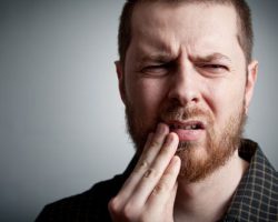 Guy suffering from toothache | West Liberty, IA, North Liberty, IA and Muscatine, IA | Gentle Family Dentists